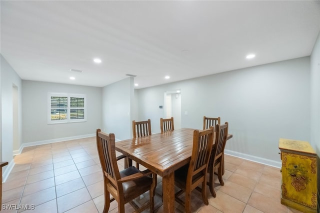 dining space with light tile patterned flooring, recessed lighting, and baseboards