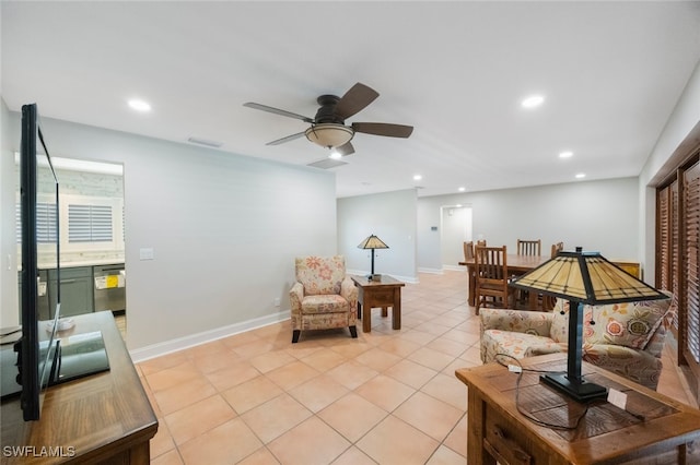 living room featuring recessed lighting, baseboards, and light tile patterned floors