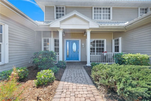 doorway to property with a porch