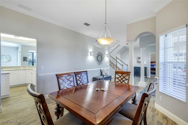 dining area with visible vents, arched walkways, crown molding, and ornate columns