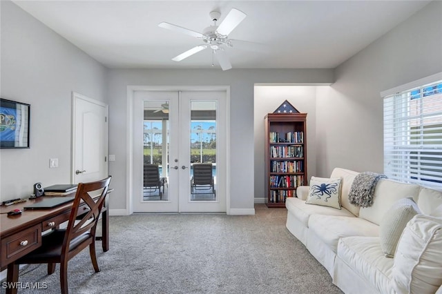 living room featuring carpet flooring, french doors, baseboards, and a ceiling fan