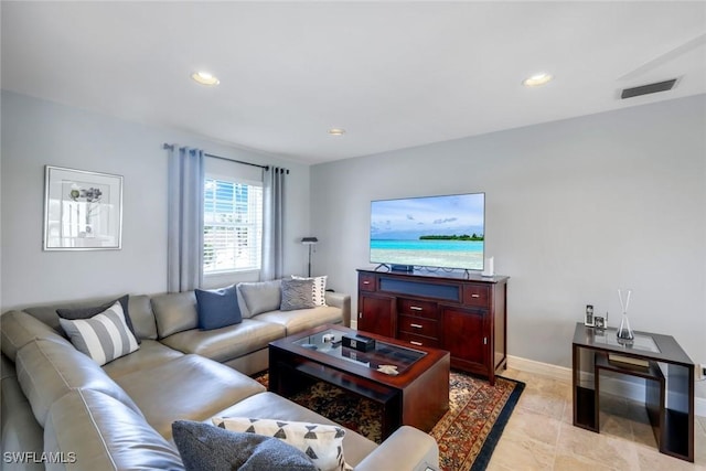 living area featuring recessed lighting, visible vents, baseboards, and light tile patterned floors