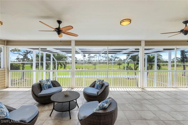 sunroom with a ceiling fan