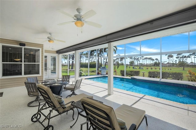 pool featuring french doors, a patio, ceiling fan, and glass enclosure