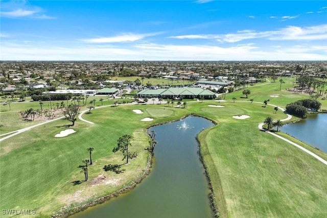 birds eye view of property featuring a water view and golf course view