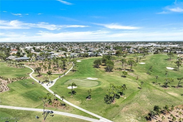 birds eye view of property with golf course view