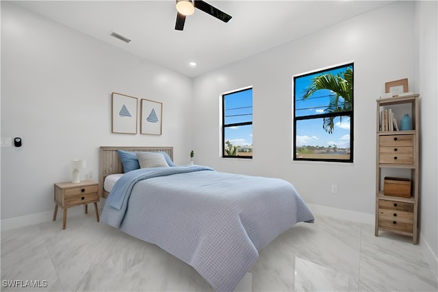 bedroom featuring a ceiling fan, baseboards, visible vents, and marble finish floor