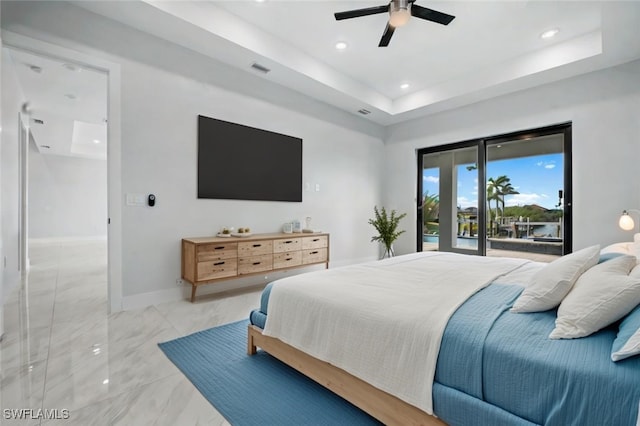 bedroom with baseboards, a tray ceiling, recessed lighting, ceiling fan, and access to outside