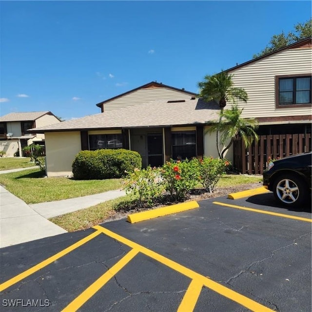 view of front of property featuring uncovered parking