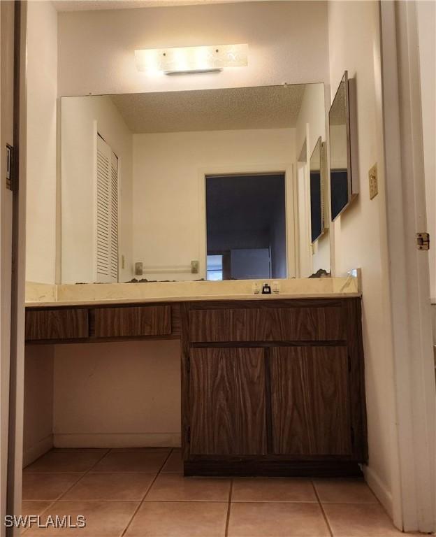 bathroom featuring tile patterned flooring and baseboards