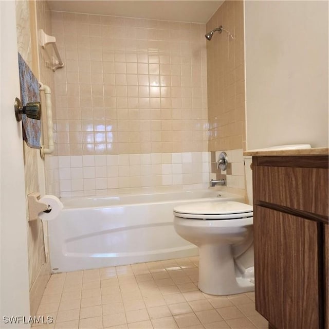 bathroom featuring tile patterned flooring, toilet, vanity, and shower / bath combination