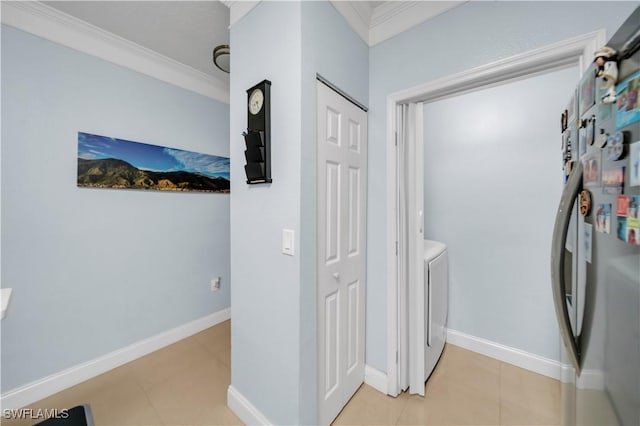 11510 Villa Grand Unit 408, Fort Myers, FL 33913 - washroom featuring crown molding, laundry area, baseboards, light tile patterned floors, and independent washer and dryer