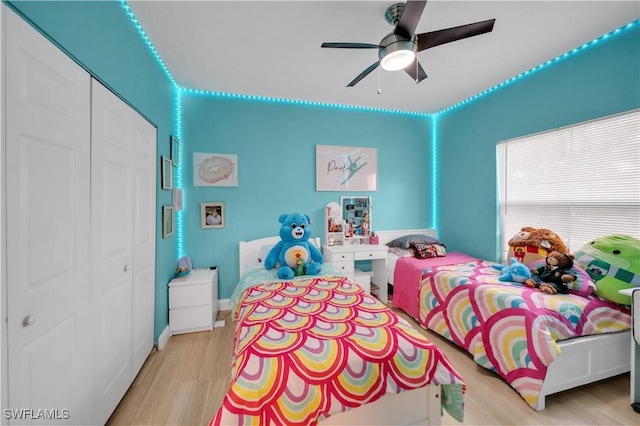 11510 Villa Grand Unit 408, Fort Myers, FL 33913 - bedroom featuring a closet, a ceiling fan, and light wood-type flooring