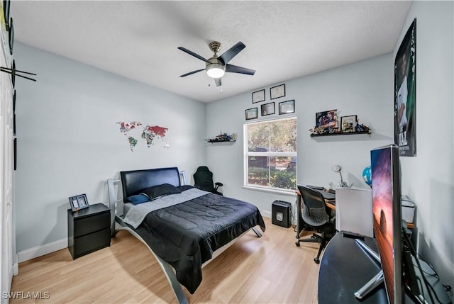 11510 Villa Grand Unit 408, Fort Myers, FL 33913 - bedroom featuring a ceiling fan, baseboards, and wood finished floors