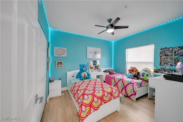 11510 Villa Grand Unit 408, Fort Myers, FL 33913 - bedroom featuring a ceiling fan and light wood-style flooring