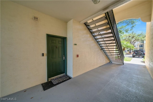 11510 Villa Grand Unit 408, Fort Myers, FL 33913 - entrance to property featuring stucco siding and visible vents