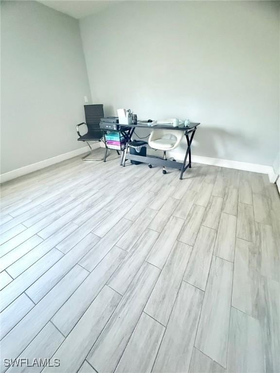 office area featuring wood finished floors and baseboards