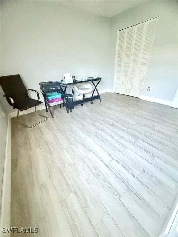 sitting room featuring wood finished floors and baseboards