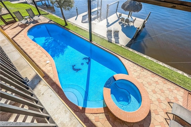 416 SW 52nd St, Cape Coral, FL 33914 - view of pool featuring a lanai, a pool with connected hot tub, and a patio