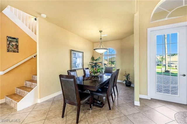 416 SW 52nd St, Cape Coral, FL 33914 - dining space with stairs, light tile patterned flooring, and baseboards