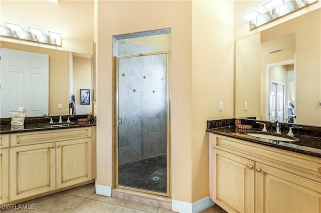 416 SW 52nd St, Cape Coral, FL 33914 - bathroom with a sink, two vanities, a shower stall, and tile patterned floors