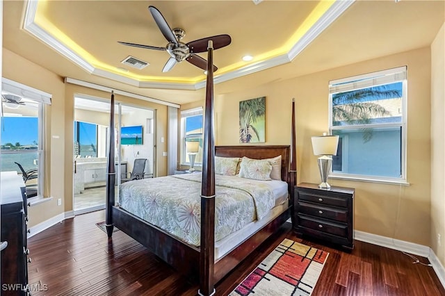 416 SW 52nd St, Cape Coral, FL 33914 - bedroom with wood finished floors, a raised ceiling, baseboards, and ornamental molding