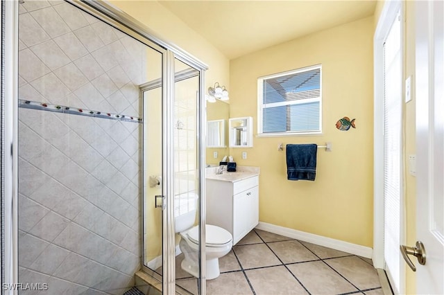 416 SW 52nd St, Cape Coral, FL 33914 - bathroom featuring tile patterned floors, toilet, a stall shower, baseboards, and vanity