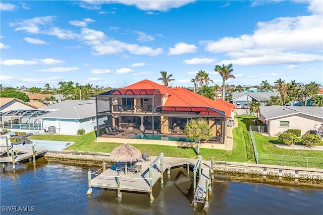 416 SW 52nd St, Cape Coral, FL 33914 - dock area featuring fence, a lanai, a water view, a yard, and an outdoor pool