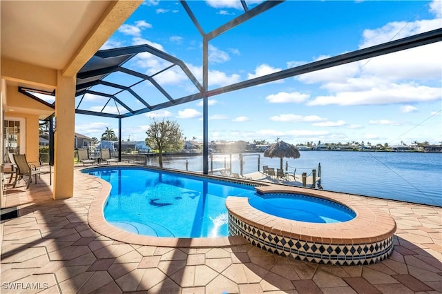416 SW 52nd St, Cape Coral, FL 33914 - view of pool featuring a water view, a pool with connected hot tub, a lanai, and a patio area