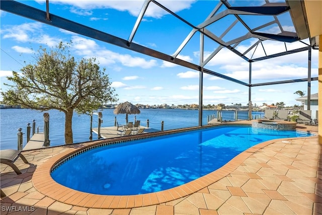 416 SW 52nd St, Cape Coral, FL 33914 - view of pool with glass enclosure, a patio area, a water view, and a pool with connected hot tub