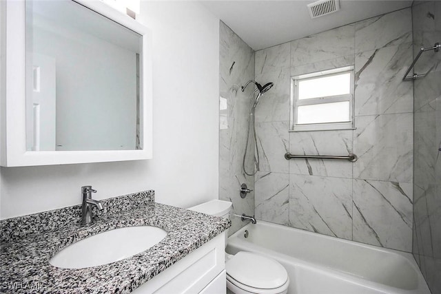 bathroom with shower / tub combination, visible vents, toilet, and vanity