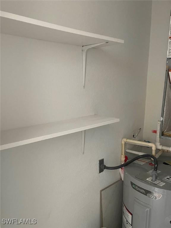 601 Periwinkle Way Unit D1, Sanibel, FL 33957 - utility room with water heater