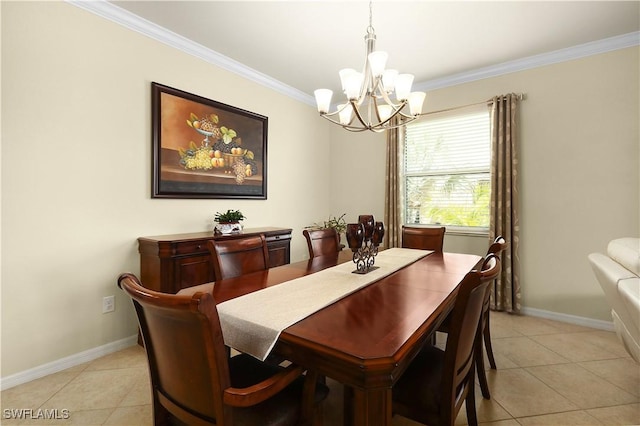 dining space with light tile patterned floors, baseboards, a notable chandelier, and ornamental molding