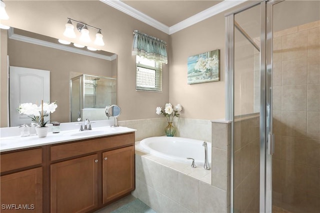 bathroom with vanity, crown molding, a garden tub, and a shower stall