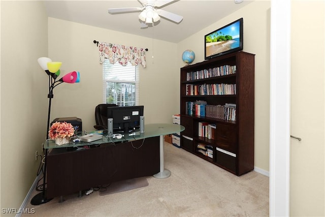 office with light carpet, baseboards, and ceiling fan