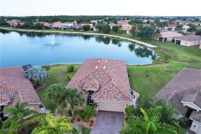 birds eye view of property with a residential view and a water view