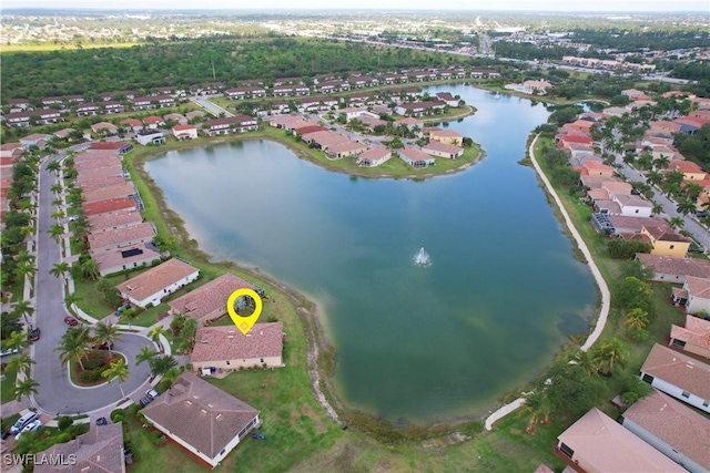 drone / aerial view featuring a residential view and a water view