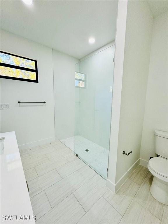 full bath with toilet, recessed lighting, baseboards, and walk in shower