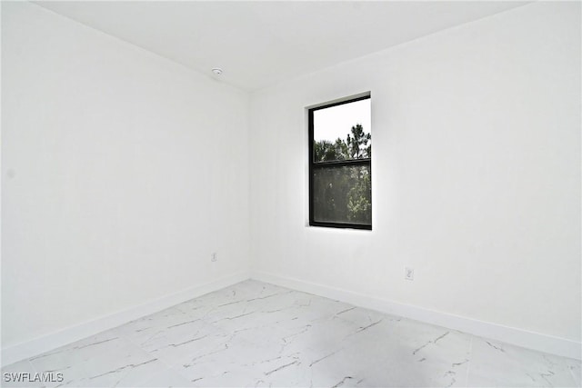 3204 69th St W, Lehigh Acres, FL 33971 - empty room with marble finish floor and baseboards