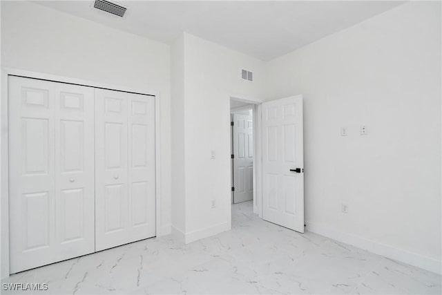 3204 69th St W, Lehigh Acres, FL 33971 - unfurnished bedroom with baseboards, marble finish floor, and visible vents