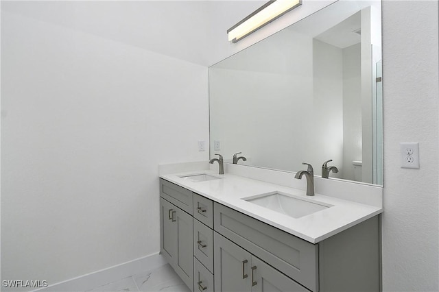 3204 69th St W, Lehigh Acres, FL 33971 - full bathroom featuring baseboards, marble finish floor, a sink, and double vanity