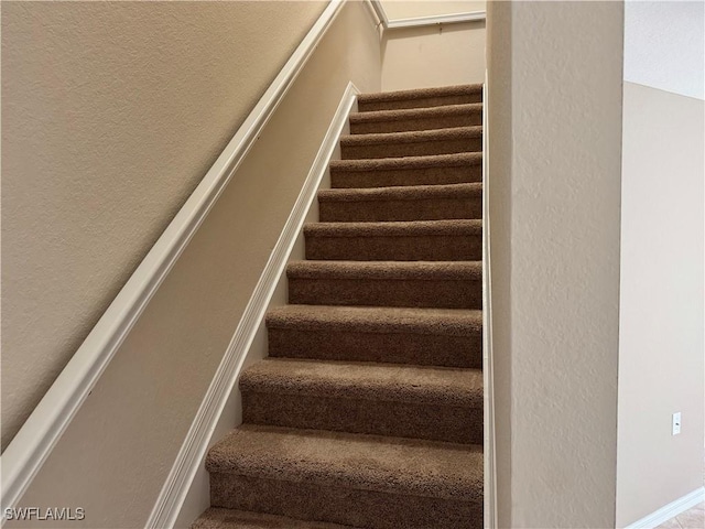 stairs with a textured wall