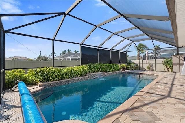 view of pool with a patio area, fence, and a fenced in pool