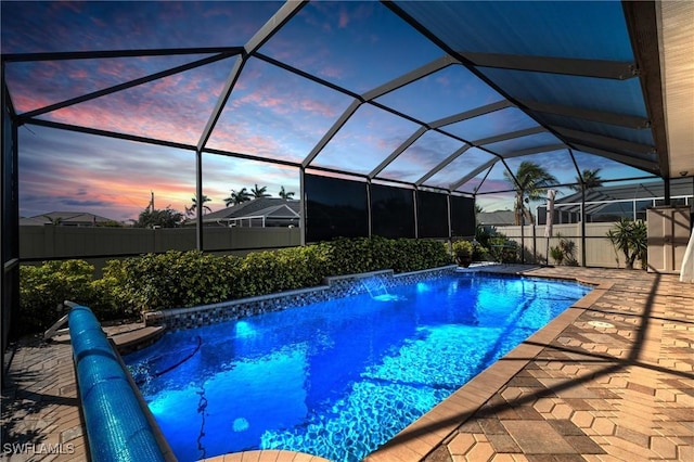 view of swimming pool with a patio area, fence, and a fenced in pool