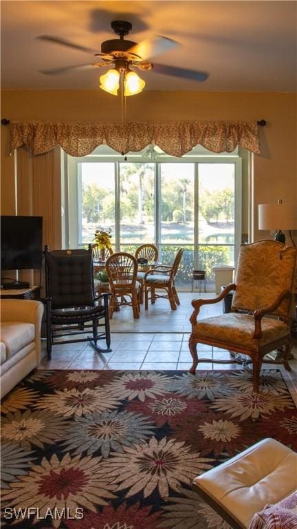 living room with light tile patterned floors and ceiling fan