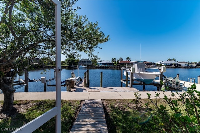 view of dock featuring boat lift and a water view