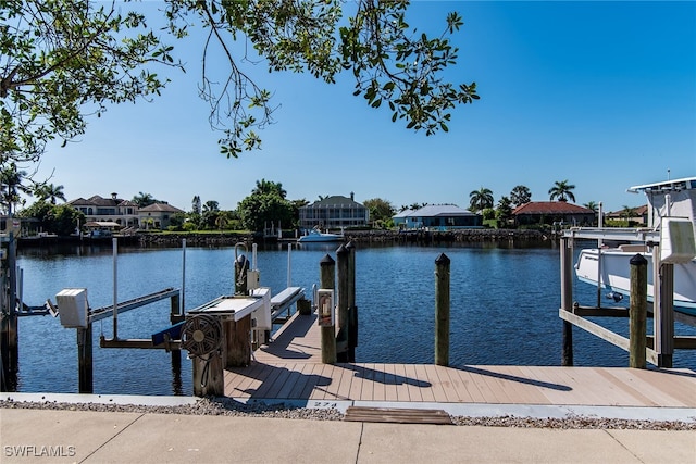 view of dock featuring a water view and boat lift