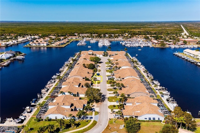 birds eye view of property featuring a water view