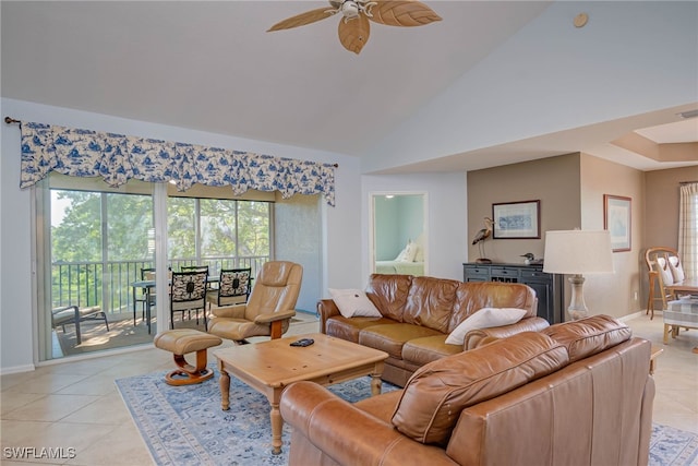 living area featuring light tile patterned flooring, high vaulted ceiling, baseboards, and ceiling fan