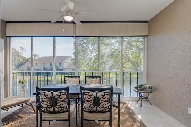 sunroom with a ceiling fan